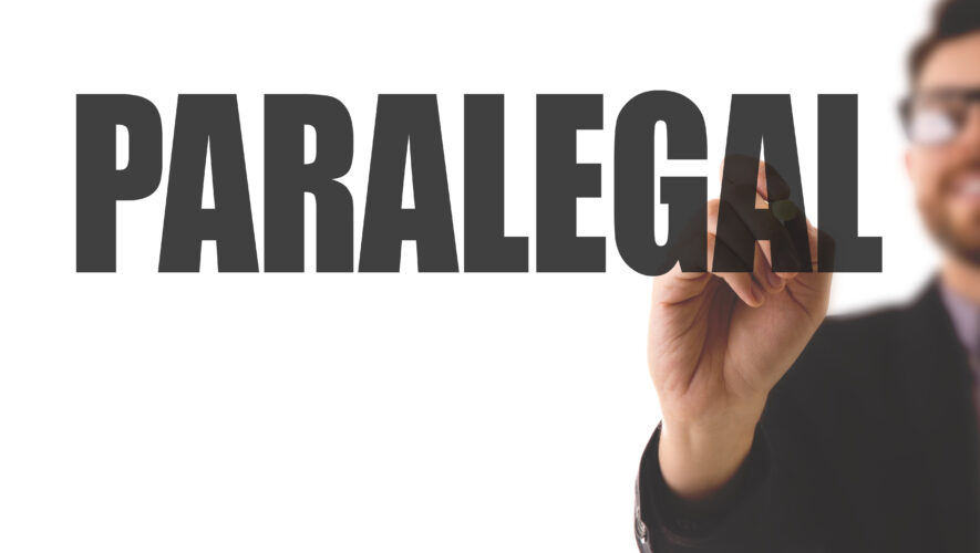 Picture at man pointing at word "paralegal"